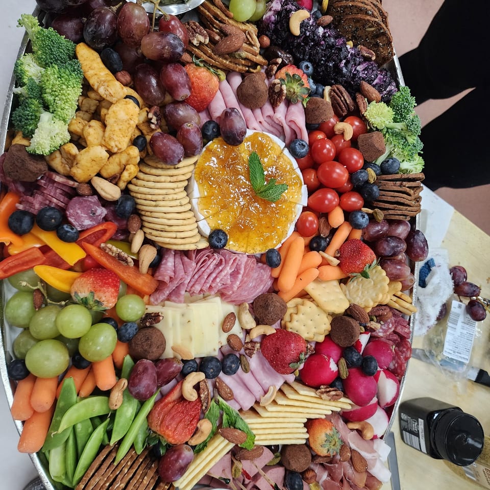 Savory platter with cheeses, meats, fruit and vegetables